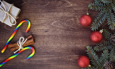 New Year's background. Spruce branches on a wooden table. Ornaments for the New Year tree. Christmas concept.