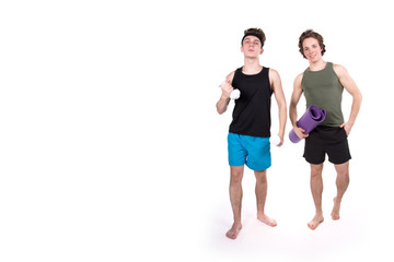 Obraz premium Sport and healthy lifestyle. Two guys. White background.