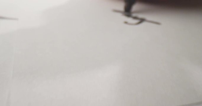 Closeup shoot of hand writing a letter on the paper with a marker. Handwriting on the sheet