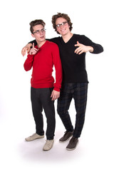 Two fun attractive students. White background. Study.