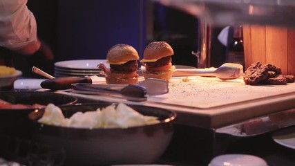 Cook prepares Burger in the restaurant