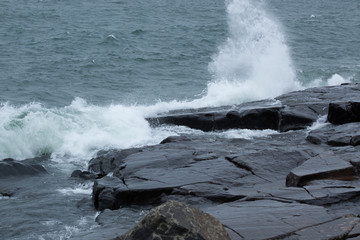 Waves of Lake Superior crashing on rocky shore
