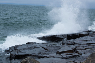Waves of Lake Superior crashing on rocky shore