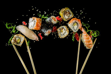 Seamless pattern with sushi. Food abstract background. Flying sushi, sashimi and rolls isolated on...