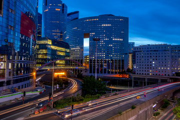 Evening Traffic Between Modern Buildings