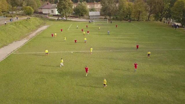 Aerial Photography football match. Amateur football players play football. 4k