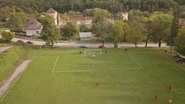 Aerial Photography football match. Amateur football players play football. 4k