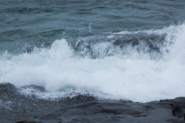 Waves of Lake Superior crashing on rocky shore