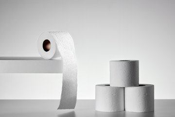 Roll of soft white toilet papers on white background