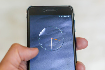 Mobile phone with clock screensaver