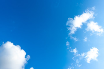 Nature Bright blue Sky with white clouds on blackground. Beautiful sky and clouds in the afternoon.