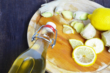 Homemade fermented raw kombucha tea with different flavorings. Healthy natural probiotic flavored drink with lemon and ginger or ginger ale. Copy space.