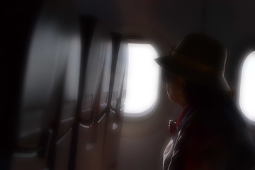 soft focus of older women on the plane.