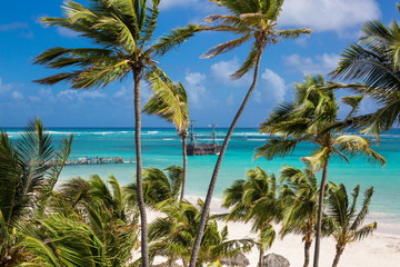 The Pirate ship is moored to the shore of a beautiful beach with white sand and turquoise water. Pirates of the Caribbean. Los Corales, Bavaro, Punta Cana