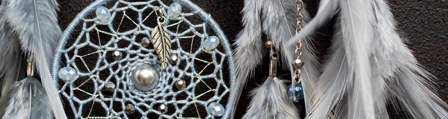 Banner of Handmade dream catcher with feathers threads and beads rope hanging