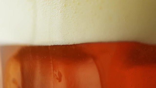 Beer head and bibbles in slow motion