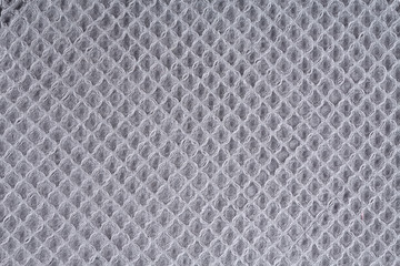 Gray corrugated cotton textile - close up of fabric texture. Cotton Fabric Texture. Gray Clothing Background. Text Space. Abstract background and texture for designers.