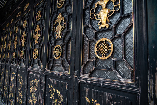 Golden lacquered wood carving flower door of the ancient architectural courtyard of Zumiaoling, Foshan, Guangdong, China