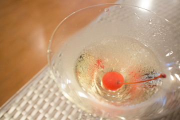 red cherry in Cocktail martini glass, close up shot