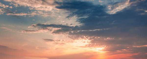 Naklejka na ściany i meble Colorful cloudy sky panorama at sunset