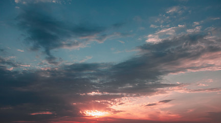 Naklejka na ściany i meble Cloudy sky at sunset, natural background