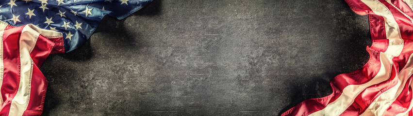 Flag of United States of America on a concrete background. Usa flags and stripes as a panoramic...
