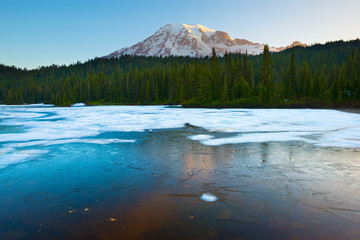 Frozen Reflection Lake and  Mount Rainier at sunrise, Mount Rainier National Park, Washington...