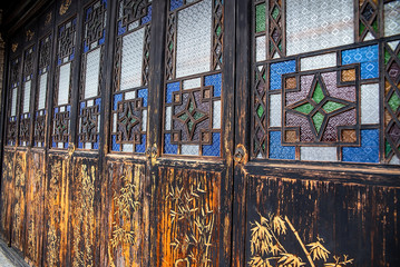 Chinese ancient building's door, sea bream pattern, stained glass door