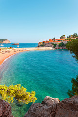 Picturesque summer view to the Sveti Stefan island with private beach, luxury resort on the Adriatic sea coast in Montenegro