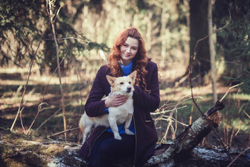 portrait of young beautiful woman hugging her dog. 