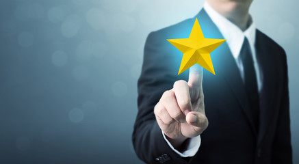 Businessman hands touch a five-star gold shape. The best excellent business services rating customer experience concept