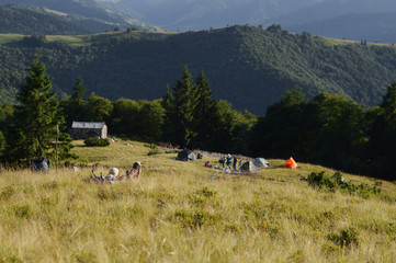 Tent city in the mountains.Carpathian Mountains.Sunset light.