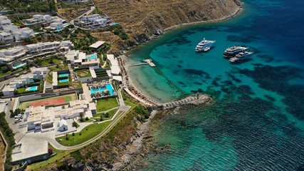 Aerial drone photo of paradise celebrity bay of Ornos famous for pool resorts and sandy turquoise...