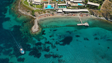 Fototapeta na wymiar Aerial drone photo of luxury yachts docked in famous turquoise clear sea bay of Ornos, Mykonos island, Cyclades, Greece