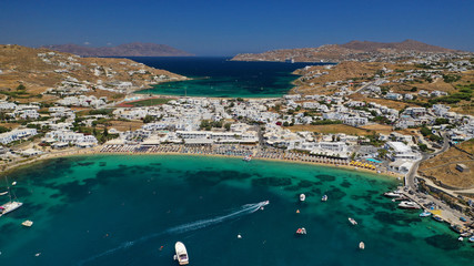 Fototapeta na wymiar Aerial drone photo of paradise celebrity bay of Ornos famous for pool resorts and sandy turquoise organised clear sea beach, Mykonos island, Cyclades, Greece