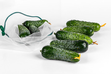 Zero waste shopping textile bag with farm fresh organic vegetable. Plastic free. Reusable, recycled, homemade produce bag for fruit. Eco friendly concept.