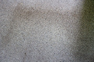 The marble floor has many black stains