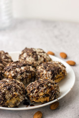 Useful homemade almond cake with coconut chips on a light background, copy space