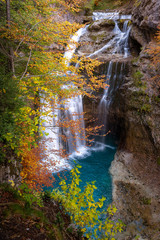 Fototapeta na wymiar Waterfall of The Cave (cascada de la Cueva) in Ordesa and Monte Perdido National Park, Spain