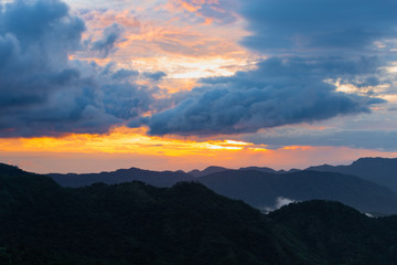Mountain view on the morning with sea of fog and sunrise light.