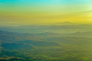 Green mountain landscape and blue sky with warm sunshine.