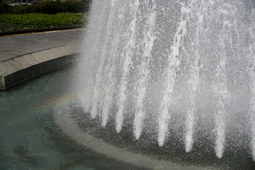 Circular fountain splash with a rainbow