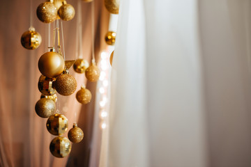 Beautiful christmas golden silver deco baubles on light background. Flat lay design. Copy Space.