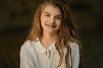 cheerful caucasian girl smiling at the camera