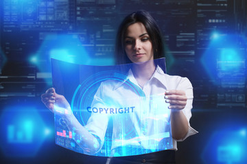 The concept of business, technology, the Internet and the network. A young entrepreneur working on a virtual screen of the future and sees the inscription: Copyright