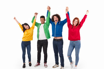 Obraz premium Cheerful international friends with raised hands