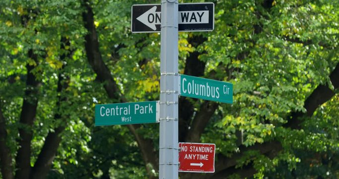 Close up Shot of New York Street Sign in An Iconic New York Side Walk With Beautiful Green Trees In New York City, Central Park