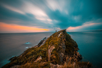 A cloudy dawn and a beautiful sun in the Basque country in the town of Fuenterrabia