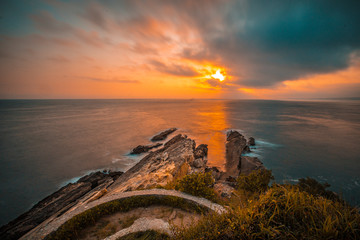 A cloudy dawn on the viewpoint of Fuenterrabia in the Basque country. Vertical photo