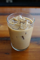 Glass of Iced Coffee with Milk on a Restaurant Bar